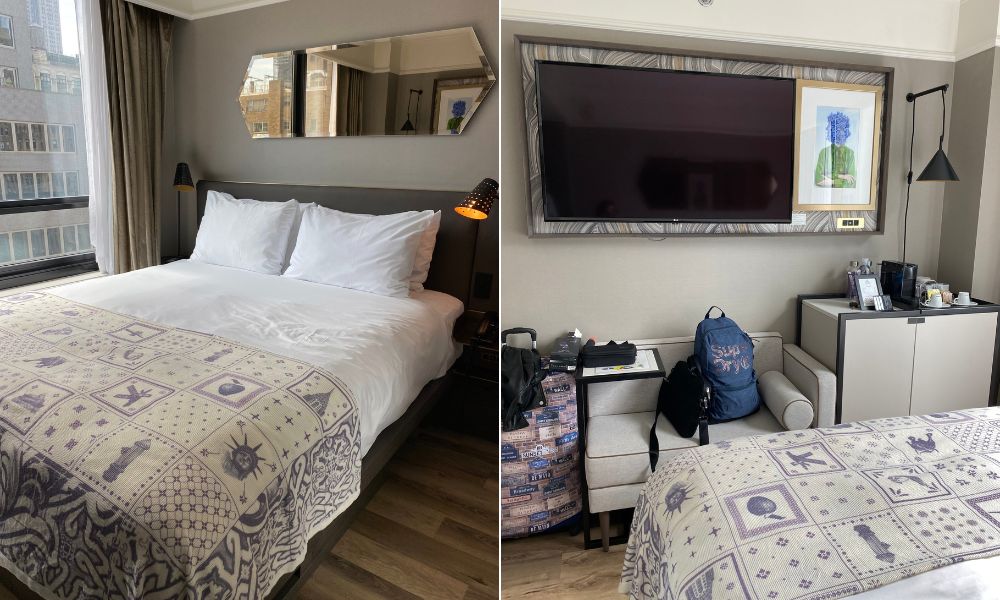 Habitación del hotel Pestana Park Avenue con cama king, acolchado con motivos de Nueva York, televisor y valijas en un espacio moderno y compacto.